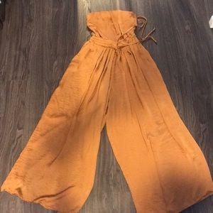 wide legged burnt orange jumpsuit